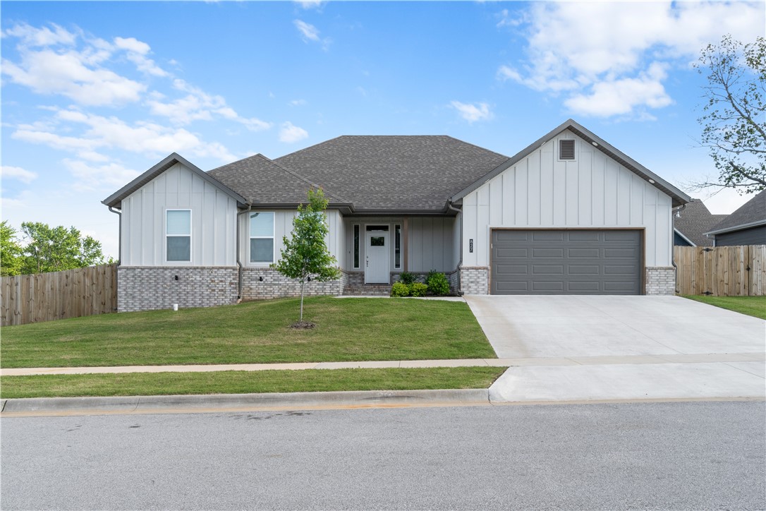 Gorgeous 2024 Built Home in Wakefield Park Community! Completely move in ready! Amazing open layout and quality features throughout plus ALL APPLIANCES INCLUDED. Enter into the bright and spacious living room w/large windows, vaulted ceilings & beautiful fireplace. Kitchen has large island for entertaining, abundant cabinet space, gas cooktop, pantry & more! Great sized dining room off kitchen. Primary suite features large WIC and attached bath with beautiful tiled shower and spacious double vanity. 3 guest bedrooms and 2 guest bathrooms provide ample space. Covered patio provides great space for outdoor living and enjoying your fully fenced yard. LVP flooring throughout whole home, Nest Thermostat. 2 Car garage. Great location with easy access to Fayetteville and University of Arkansas. Close to parks and downtown Prairie Grove. Welcome Home!