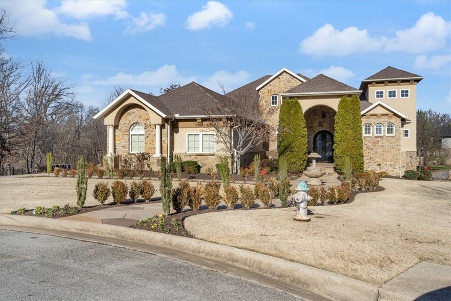 Welcome to Pinnacle Hills Country Club, the epitome of elegance in NWA. Step inside this gem built in 2011 nestled on a RARE 1-acre lot with a Gunite pool, new hot tub, outdoor kitchen, and a gas fire pit. Located at the end of a cul-de-sac for maximum privacy. A semi-open floor plan caters to both large and small gatherings alike. Oak floors on the first level, waterfall feature above the fireplace, hearth room boasting its own fireplace and two laundry rooms. The chef's kitchen is equipped with built-in espresso machine, wine cooler, trash compactor, double ovens, a gas cooktop with a skillet, a commercial fridge, and a vegetable sink. The primary features a fireplace, reading nook, and balcony access. Its luxurious bathroom has a stunning two-story cathedral wood ceiling, an oversized walk-in shower with rainshower feature. The walkout basement is built for entertainment with concrete floors for easy maintenance, a full wet-bar, temperature-controlled wine cellar and movie lounge.*Zoned for Bentonville Schools*
