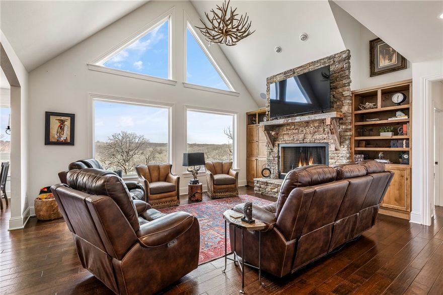 This gorgeous 5 bedroom, 4.5 bath home is located in the gated & sought after subdivision South Mountain Estates on Beaver Lake. With attention to every detail & beautiful lake views, this is a fantastic home for entertaining guests. The home will also include the washer/dryer set, universal gym set, brand new boat locker that is approved, hot tub, shuffleboard table, 2 boat slips & 2 boat lifts (one lift which is new 2024) the paddle board on boat slip #1, everything in the bunk room, kitchen refrigerator & 2 mini fridges in enclosed sunroom. The home also has brand new HVAC, new garage doors & new sidewalks. This is truly lake living at its finest.