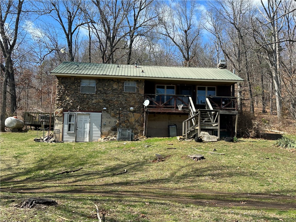 Older home on 20 acres with end of the road privacy. Large pond in front yard. House has a full basement that is half finished. Half of the basement is finished and used as laundry room and a bedroom with a small living room and the other half is storage/garge. Property is currently used as a rental. 20 acres of mostly woods with an abundance of wildlife. No well on 20 acres but is hooked to well at the top of the hill at the other house so property will be sold with a well agreement.
