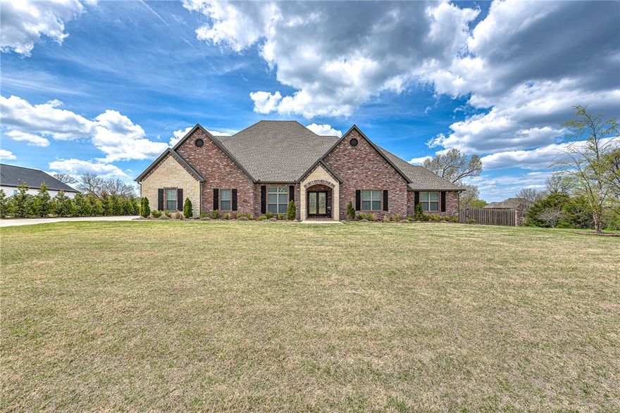 Love entertaining? Custom open concept home located within a short drive to downtown
Rogers/Bentonville. Quiet upscale neighborhood features large lots & beautiful homes. Walk
through the oversized French doors & you’ll be greeted by a HUGE 1200 sq ft living space. Main floor features dining room/office, magnificent owners suite & guest wing where you will find 3 large bedrooms 2.5 baths. Kitchen has professional appliances, double oven, quartz countertops, oversized island, & gas range. Upstairs there's an additional guest suite with large bonus space featuring wet bar and fireplace. All bedrooms feature large closets. High ceilings throughout. Backyard with privacy fencing, covered porch & built-in grill. Motorized sunshade makes outdoor living possible year-round. Meticulously maintained.
Additional features: oversized 4 car garage, central vac, irrigation, outdoor Lutron lighting, NEST
thermostats, custom Christmas lights & too many other details! You must see this GORGEOUS
home!