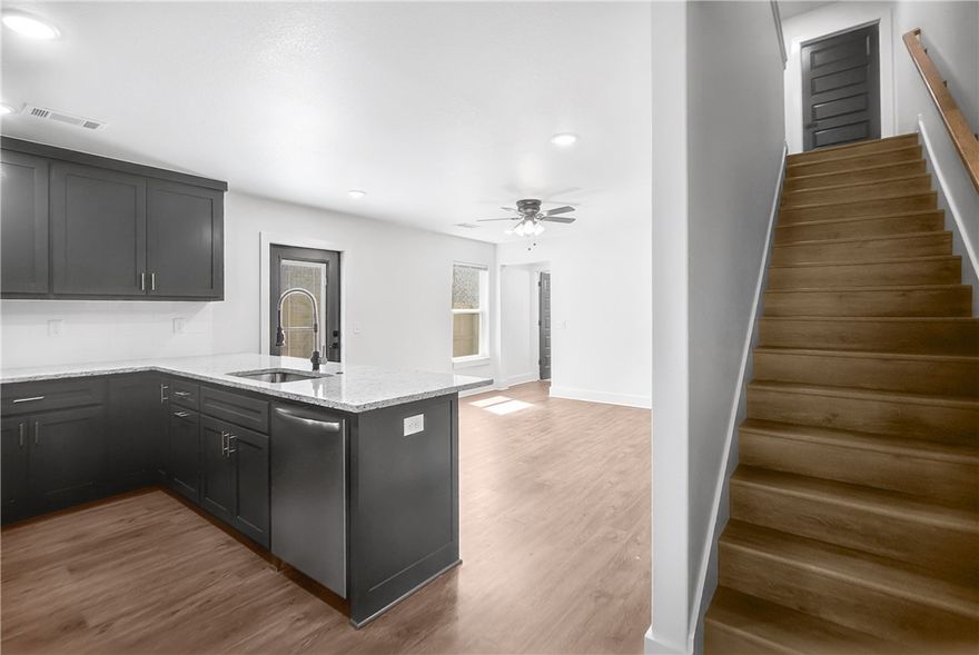 Welcome To Your Next Home! Situated In A Reviving, Established Neighborhood, Just Steps Away From The Brand-New Walmart Campus, This 4-Bedroom, 2-Bathroom Single Family Attached Homes Blends Comfort With Convenience. Imagine Waking Up In Your Spacious Main-Floor Primary Bedroom, Sipping Coffee In The Sun-Filled Kitchen. Upstairs, You'll Find Three More Bedrooms, Perfect For Guests, Home Offices, Or Whatever Your Life Needs. The Fully Fenced Backyard Offers A Safe, Private Space For Outdoor Fun Or Quiet Evenings Under The Stars. Whether You're Headed To Downtown Bentonville Or Exploring The Best Of Northwest Arkansas, You're Just Minutes Away From It All. This Is More Than Just A House—It's A Place To Create Memories, Share Laughter, And Truly Feel At Home. Homes In This Area Are Going Fast As The Neighborhood Continues To Grow, Transition, And Add Value—Schedule Your Showing Today Before This One Slips Away!