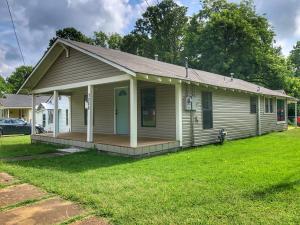 WOW! This may be the cutest house in Russellville. This home is in mint condition with hardwood floors in all bedrooms and beautiful ceramic tile throughout. The roof was replaced in August 2018. The privacy fenced back yard along with a custom built workshop and a large covered deck makes for pure paradise and an oasis for relaxing. Don't miss seeing this one! Priced to sell at $134,900.