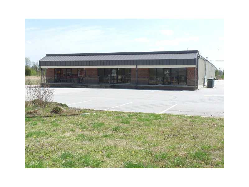 Bank-owned office building & warehouse sitting on almost 2 acres. Both are vacant and in good condition. Office building includes kitchen, 3 bathrooms, several offices of various sizes, phone system w/voice mail & security system. Space is also for lease.,Warehouse was built in 2006 and is fully insulated, has (10) 14' high, 12' wide overhead doors, gas space heaters and some offices built inside with bathrooms. Part of warehouse was used as a flea market and has some booths still installed.