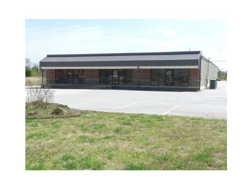 Bank-owned office building & warehouse sitting on almost 2 acres. Both are vacant and in good condition. Office building includes kitchen, 3 bathrooms, several offices of various sizes, phone system w/voice mail & security system. Space is also for lease.,Warehouse was built in 2006 and is fully insulated, has (10) 14' high, 12' wide overhead doors, gas space heaters and some offices built inside with bathrooms. Part of warehouse was used as a flea market and has some booths still installed.