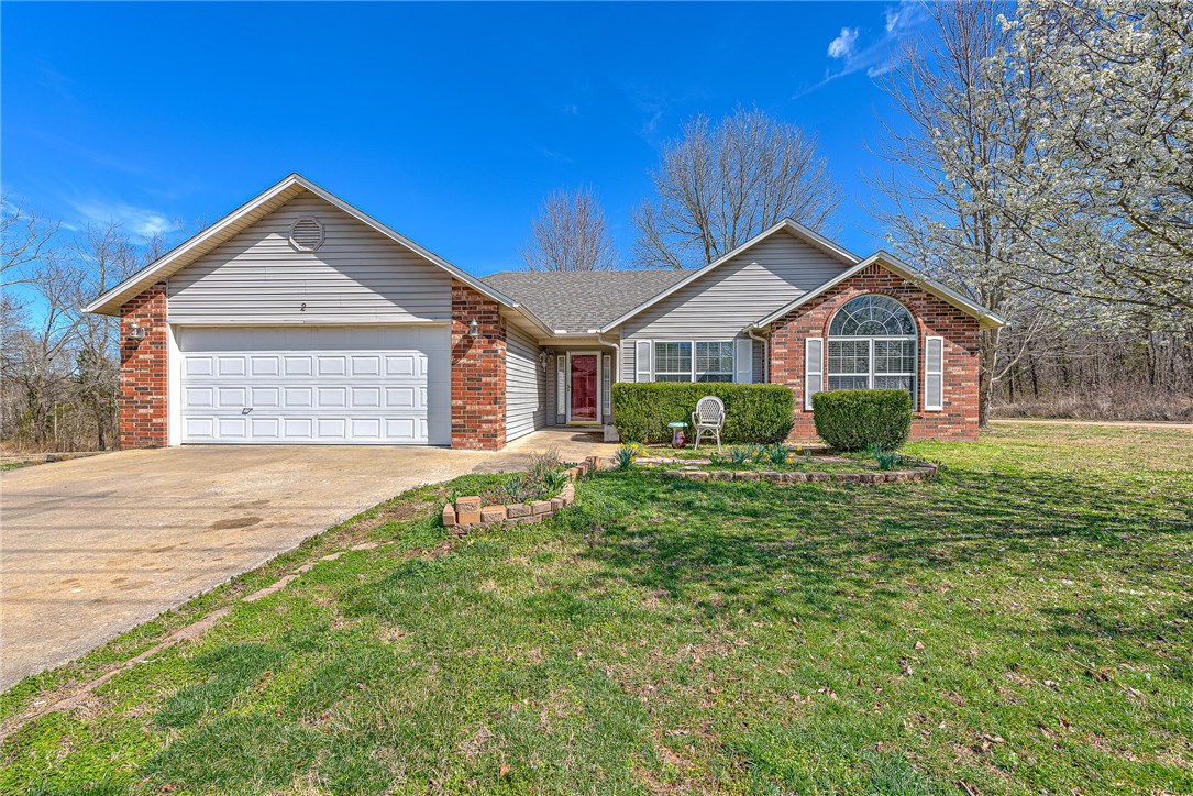 Lovely 3 bed, 2 bath, single-story home located in Bella Vista, AR! Walk in to find hardwood floors lining the main living areas, complimented by white tile in the kitchen, beautiful cabinetry and large windows that let plenty of natural light in. A semi-open floor plan creates fluidity between the kitchen, dining room and living room. Cathedral ceilings in the living room and recessed ceilings in the master bedroom create a more spacious feel to the space. Cozy up next to the gas fireplace in the living room or enjoy time outdoors on the covered, enclosed patio with ceiling fan and screen-doors that looks out into the spacious, wooded backyard. With just over 1,400 sqft. on a spacious 0.33 wooded lot, this home offers comfort and tranquility. Located close to the Back 40 Trails, Bella Vista Golf Course and Country Club as well as US-71!