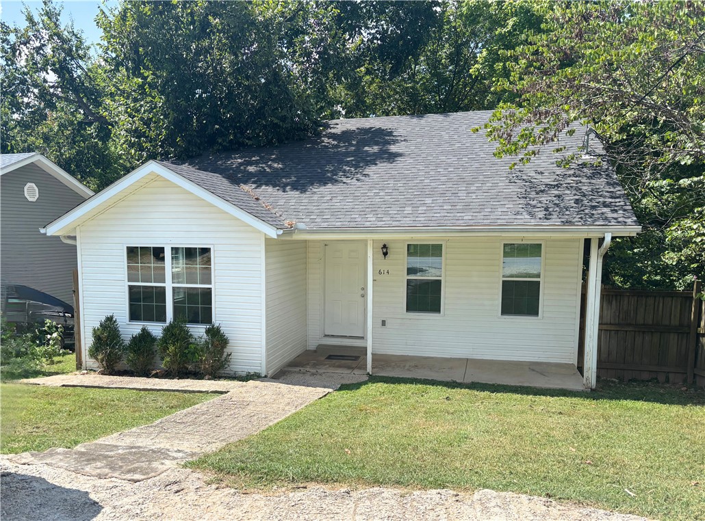 Great location! This home is 5 minutes from downtown Rogers and all the bustling activity the thriving downtown has to offer, and a stones throw from Lake Atalanta with its trails parks and the Railyard. This two bedroom, one bath home is perfectly situated on a quiet street with a wooded, secluded back yard to escape to your own oasis. Upgrades include a new roof in 2022, fresh paint, LVP flooring throughout (no carpet!), blinds and a great kitchen with granite countertops, eat-in kitchen area and large storage room off of the laundry. This home has proven to be a great rental if an investment property is what you have in mind.