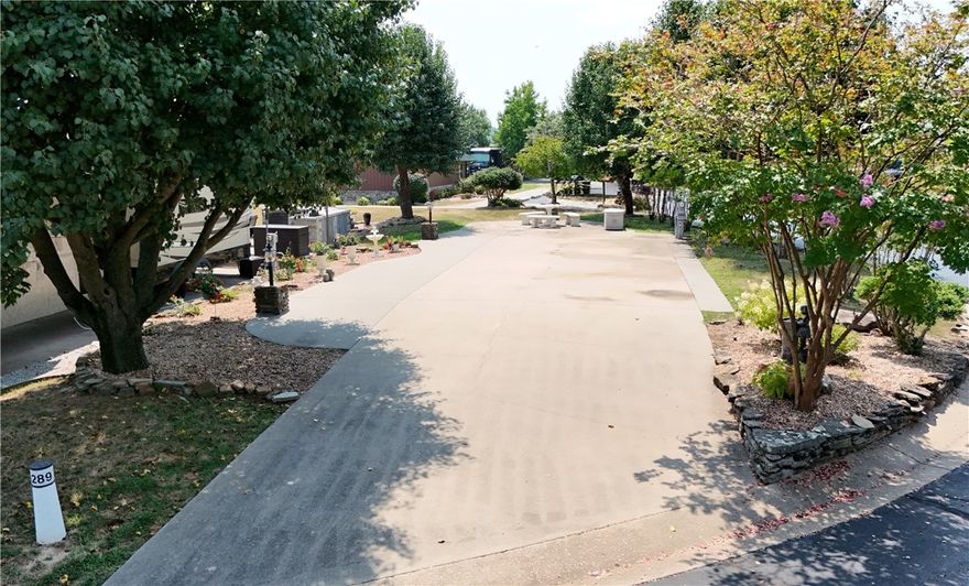 Experience the best of lakeside living in this premium back-in lot in a luxury RV resort on beautiful Table Rock Lake. Ideally situated just steps from the pool and bathhouse, this site offers both convenience and comfort for a relaxing getaway. Enjoy full hookups and a spacious setup designed to accommodate your RV with ease. After a day on the water and some of the best fishing in the Ozarks, unwind with breathtaking sunset views. Gorgeous landscaping and plenty of parking.