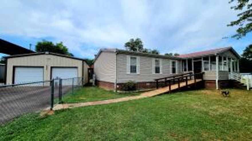 Need space? Need a large yard? Need a garage / shop? This 4-bedroom 2 bathroom manufactured home may be just what you are looking for. The property is very well kept with an enclosed porch perfect for relaxing. There are 2 living areas, and it offers a split floor plan. All appliances will convey in this convenient, nice sized kitchen. The utility area will convey the washer and dryer and a great pantry area. The spacious yard is completely fenced with chain link around the home. The 24 x 30 2-car garage has automatic doors openers on both sides and next to it is a steel covered RV shed. There is also a storm shelter in the backyard. This is located in the Carter Cove area very near Nimrod Lake.Inside pics coming next week.