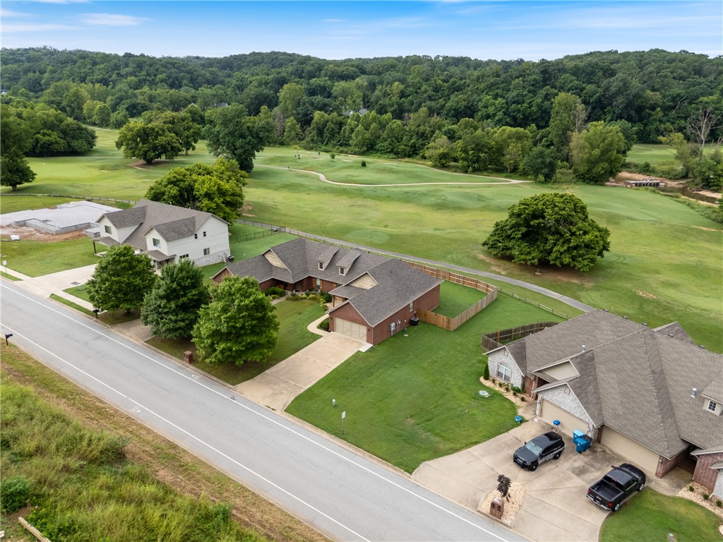 Experience refined golf course living in this stunning, fully furnished townhome, situated on Hole 7 of the Big Sugar Golf Course. Enjoy views of manicured greens, mature trees & the calming waters of Big Sugar Creek right from your backyard. This home has been thoughtfully updated, featuring a brand-new roof, HVAC, LVP flooring, carpet, deck, privacy fence, gutters & downspouts. Step inside to a spacious open-concept layout with soaring ceilings and abundant natural light. The kitchen is both stylish and functional, showcasing stainless steel appliances, a gas range, open shelving, modern tile, pantry & cabinet space. Relax in the inviting living room complete with a cozy gas fireplace, or host unforgettable dinners in the formal dining room with crown molding & wainscoting. The expansive primary suite offers tall ceilings, a ensuite bath with a jetted tub, walk-in shower, dual vanities & a large walk-in closet. Step out onto the back deck to soak in the peaceful golf course setting. Could also be used as Airbnb.