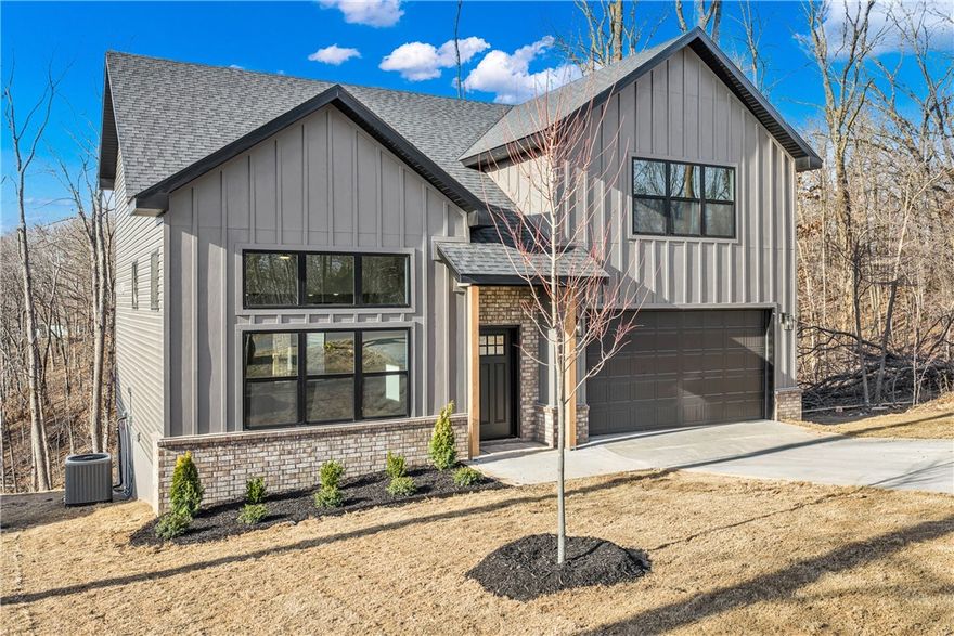 Welcome home to this stunning brand-new construction nestled in the heart of Bella Vista! This 3-bedroom, 2-bath home offers 1,899 square feet of thoughtfully designed living space on a cleared 0.34-acre lot. You'll love the upscale finishes throughout, including granite countertops, luxury vinyl plank flooring, walk-in closets, and a cozy gas log fireplace. The brick exterior, covered patio, and deck make outdoor living a dream, while the attached 2-car garage adds everyday convenience. As a Bella Vista POA community member, you'll enjoy world-class amenities including pools, tennis courts, walking and mountain biking trails, multiple boat docks, clubhouse, exercise room, golf courses, and so much more.. Zoned for Bentonville Schools and located near parks and trails, this home truly has it all. Don't miss your chance to be the first to call this beautiful new build yours!