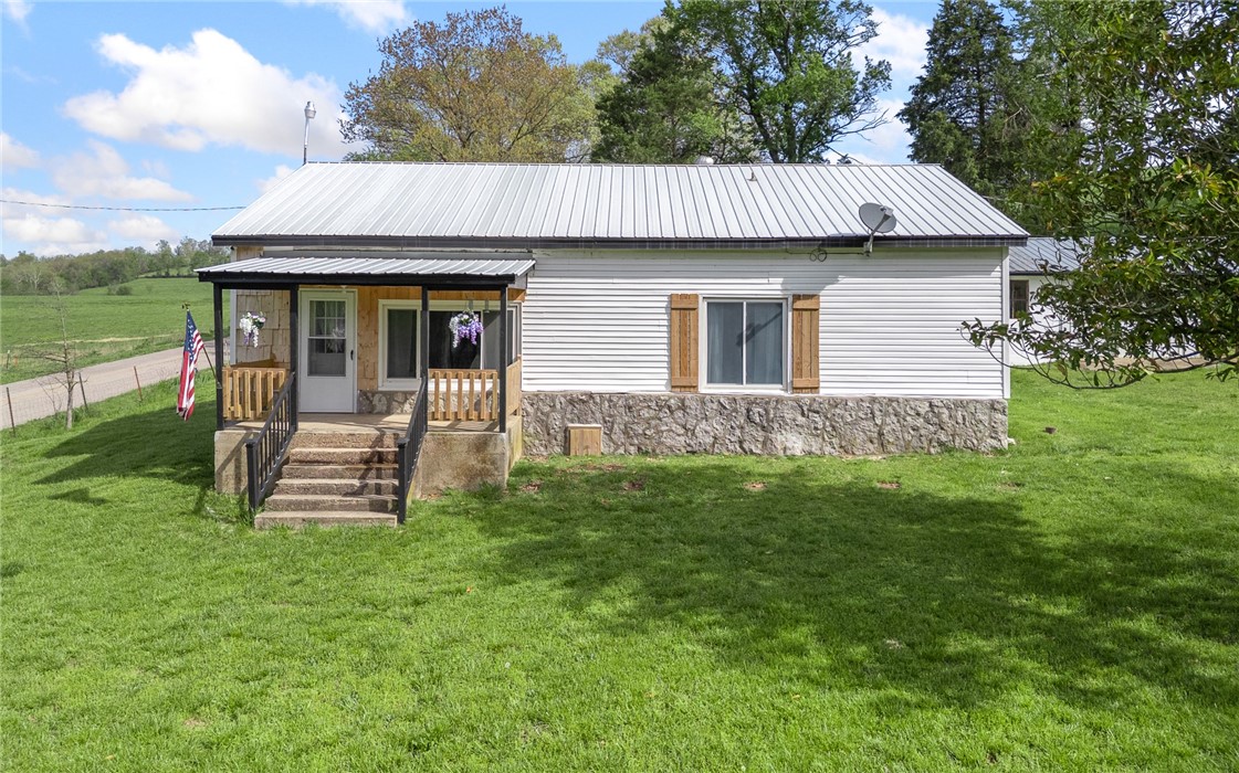 Welcome to your dream homestead! This beautifully updated 1955 farmhouse sits on a 5-acre parcel, fully fenced and cross-fencedāperfectly set up for farm animals, chickens, and peaceful rural living. Home offers 3 bedrooms and 1.5 bathrooms, including a unique loft-style third bedroom for guests, kids, or a creative studio. Modern updates with original farmhouse character, hardwood floors, sweeping tall ceilings, crown molding, and more. This property is a true hobby farmer's paradise. You'll find a spacious 29x30 shop building, a storm and root cellar, a greenhouse for year-round gardening, a carport, and a 30x9 building that could easily be transformed into a cozy guest house, rental unit, or home office. Rural water service, plus added flexibility with three well heads on the propertyāideal for irrigation, livestock, or backup water supply. Whether you're looking to start your own mini-farm, escape the city, or simply enjoy wide open spaces, this turnkey property offers the lifestyle you've been dreaming of.