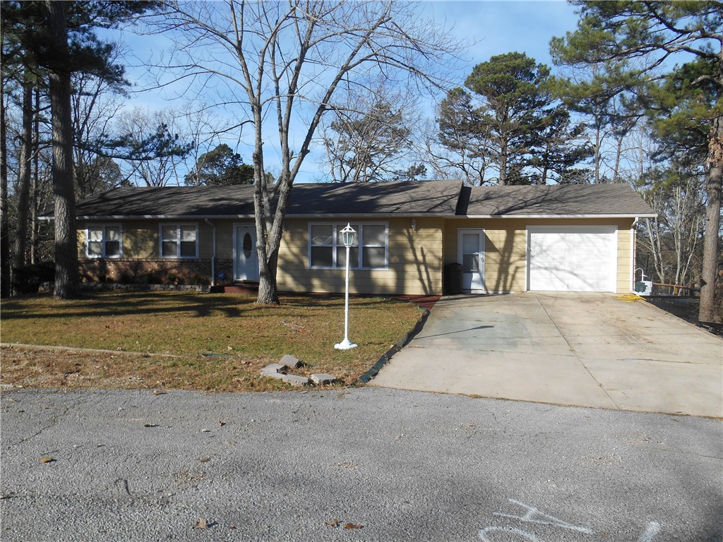 This home is located in town but in a tucked away neighborhood. Enjoy entertaining with your above ground heated pool with decks all around. You have access to the decks and pool from both levels. Kitchen boasts of Stainless Steel appliances & concrete counter tops. Hardwood floors on upper level. This house has room for everyone with 2 bedrooms 2 bathrooms up and 2 bedrooms, Den, family room and bath down. Living room has indirect lighting. Fenced back yard.