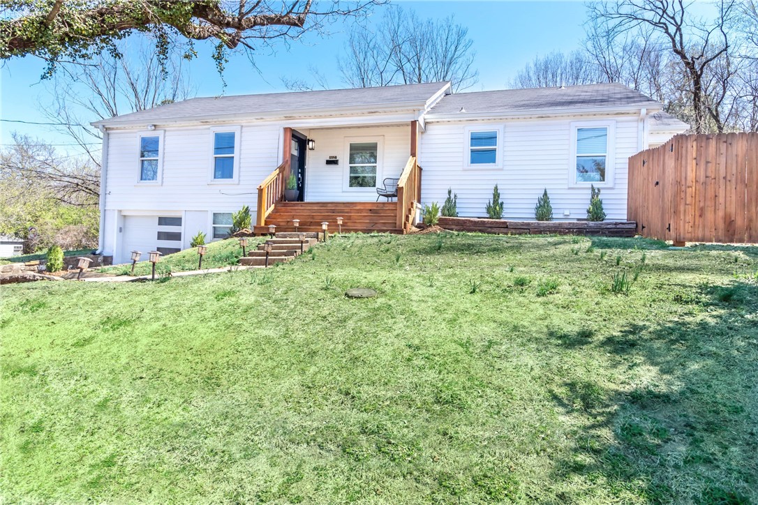 Located a few blocks from downtown on the edge of the Fayetteville Historic District! This leased and recently renovated home features 3 bedrooms, 2 baths and sits on a beautiful corner lot with mature trees, a covered front porch, and a new deck out back. Remodeled kitchen includes all new tile flooring, custom cabinets, lighting, granite countertops, backsplash, and stainless appliances. New windows, lighting, granite counters, and paint throughout. Both bathrooms completely remodeled and the original hardwood floors have been refinished! New front door, front steps, garage door, and wood privacy fence. This property is leased thru 5/31/25 for $3,300/month. Investors take note!