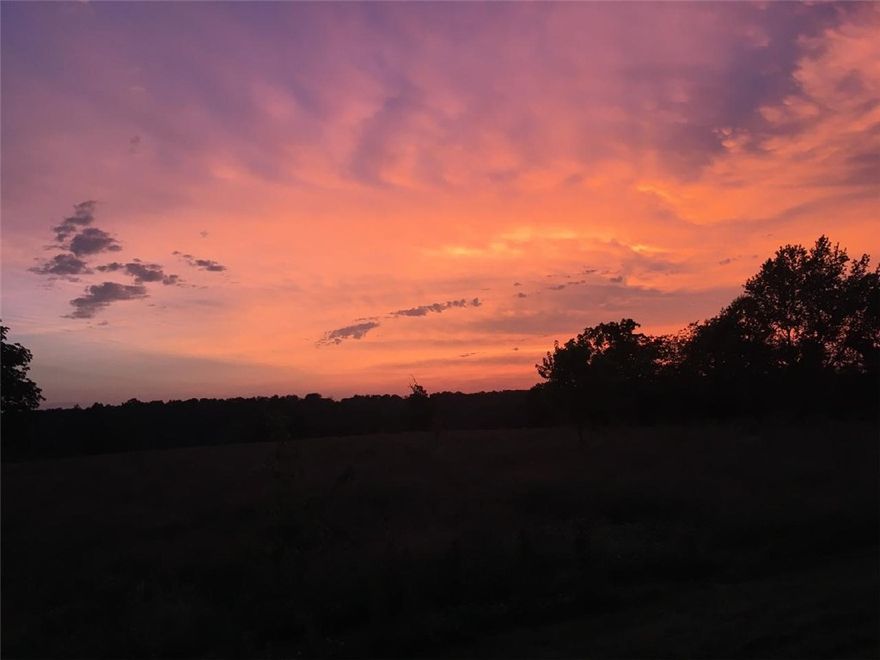 What a beautiful spot to build your dream home. Amazing sunsets await as you relax in the evenings. This property is 21 plus acres of rolling hills and several hardwood trees. There is even a spring that comes out from below a tree on the lower end of the property. Water and electrical are available at the street. Just minutes to XNA and Bentonville, yet secluded to give you that peaceful country feel. Come see this property today. Potential for development in this pristine setting. Current construction of new airport bypass will allow for even more convenience to all of Northwest Arkansas.