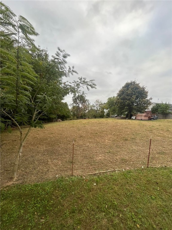 This lot is conveniently located! Corner lot, close to main roads, minutes away from Downtown Rogers. Zoning has to be verified by buyer. Per perc test only light commercial.