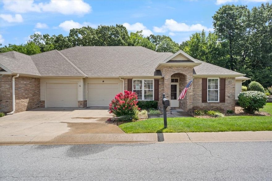 “Lock, leave & live! Updated Bella Vista townhome with sunroom, wooded views & private clubhouse access.”Beautifully updated townhome in private Highland Park Villas! Lawn watering, exterior care, and more are provided by the Townhouse Association for true lock-and-leave living. Inside, the 2020-updated kitchen with new cabinets, flooring, lighting & appliances opens to the living room and café area. Formal dining, office, and a lovely sunroom with wooded views add comfort and flexibility. Primary suite with bath ensuite plus a private guest suite for visitors or snoring spouses. Enjoy the propane fireplace with blower, built-ins, pantry, and abundant garage cabinetry. Covered & open deck extend outdoor living. New roof 2020. Residents enjoy a private clubhouse for games, pool, and social time, plus a paved walking path exclusively for villa owners. Move-in ready and designed for a less work, more play lifestyle!