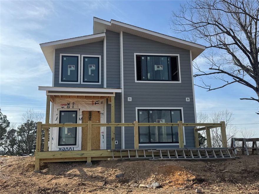Stunning New Construction Cabin with breathtaking Arkansas Grand Canyon views. Escape to the beauty of the Ozarks in this brand-new 3-bedroom, 2.5-bath cabin nestled on 1.60 acres with Scenic Highway 7 frontage just south of Jasper. This thoughtfully designed two-story, 1,621 sq ft retreat offers panoramic views of the Arkansas Grand Canyon and is perfectly located near the Ozark National Forest, Buffalo National River, hiking trails, waterfalls, and all the natural wonders this incredible region has to offer. Step inside to find a modern open layout with abundant natural light. Buy now and customize your interior—you can still choose your flooring, colors, and final touches to make it truly yours! Wake up to mountain sunrises and relax on your spacious deck as you take in the sweeping canyon views. Whether you’re looking for a forever home, a vacation getaway, or a lucrative short-term rental, this property offers unmatched potential in one of Arkansas's most scenic destinations.