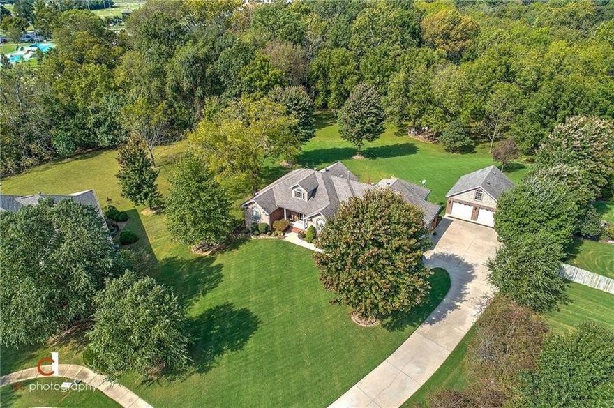 LOCATION-LOCATION-LOCATION --- ONE-OF-A-KIND PROPERTY located in prestigious GLENBROOK Subdivision, set on nearly 2 acres of the most beautiful park like property in Bentonville with a private setting and gentle creek, all within walking distance to Downtown Bentonville, Crystal Bridges, new Walmart Campus and so much more.  With 6 bedrooms and 4 bathrooms this property is VERY UNIQUE:
- 2 Kitchens
- 2 Laundry rooms
- 2 Primaries with ensuite bath
- 2-3 Living Areas
- 1600+ sq ft of Outdoor living area with fireplace, heaters, ceiling fans & wired surround system
- 4 car garage
- Fully remodeled
- Plus over 300 sq ft of unfinished storage/storm shelter
2001 Custom built home that has undergone significant renovations.  Fully remodeled in 2019-2021 with hundreds of thousands in renovations, remodels and improvements