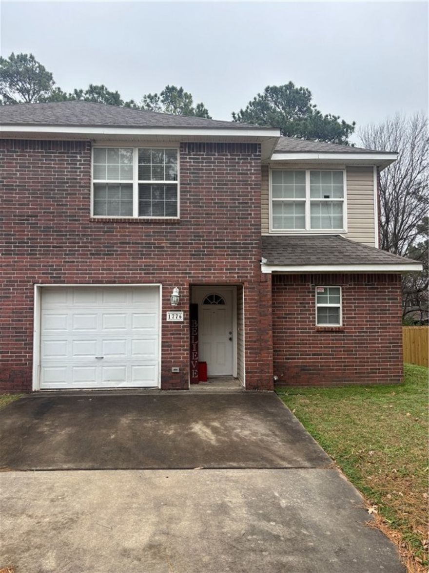 Available January 1. Conveniently located just off I-49, 3 bed 2 1/2 bath Townhome just minutes away from the University of Arkansas, great schools and parks. Bus stop is right outside the home and Police station around the block. This home features a spacious living room with wood laminate flooring, U-shaped kitchen & bar, guest bathroom and patio. All appliances included.