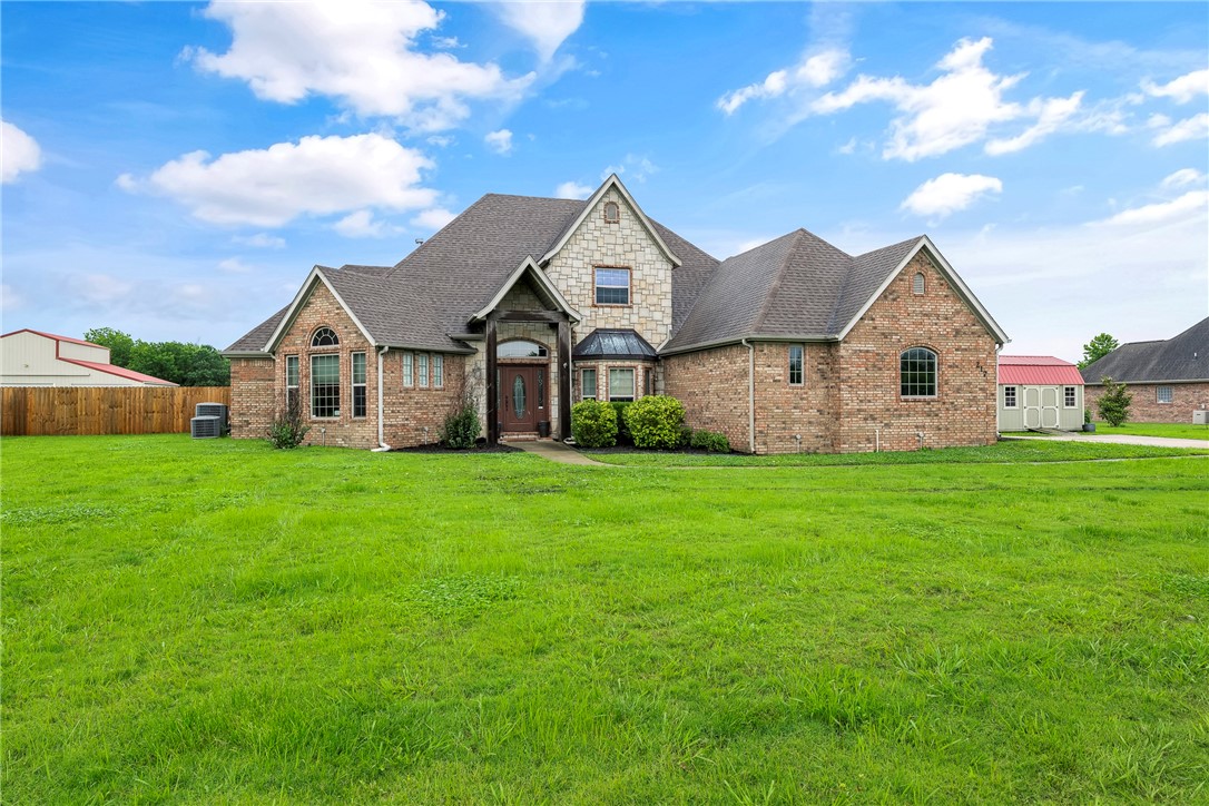 Motivated Seller! Welcome to this beautiful home nestled on a spacious 2-acre lot! It is tucked away from the highway, offering a sense of seclusion with vacant land behind it. Explore this exquisite property featuring 5 bedrooms, 3.5 bathrooms, a separate office, a cozy kitchen nook, a sophisticated dining room, 2 living areas, and not just one but two main-level primary bedrooms. Perfect for an in-law retreat, the layout is ideal. Upstairs, you'll find 3 bedrooms, a full bathroom, and a loft. The home offers incredible storage, a 3-car garage, and a storage building. Come and see for yourselves how nice some space would be!