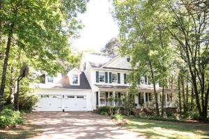 PICTURE YOURSELF RELAXING ON THE FABULOUS WRAP-AROUND PORCH of this lovely, well-landscaped Colonial two-story home in one of West Russellville's nicest neighborhoods. Four BR, 2 1/2 BA with formal dining, kitchen with large island, good pantry, breakfast area and Jenn-air downdraft range, an office or formal living rm and family rm with remote log gas fireplace and access to front and back porches. Upstairs boasts a spacious master with 2 closets, 3 large BRs and a handy walk-up floored attic space that's wired and vented to be additional finished space if desired. Beautiful hardwood floors, hardwood staircase, classic trim and moulding throughout. And don't miss the huge privacy fenced backyard! The curb appeal will draw you in, the quality construction will make you want to stay!