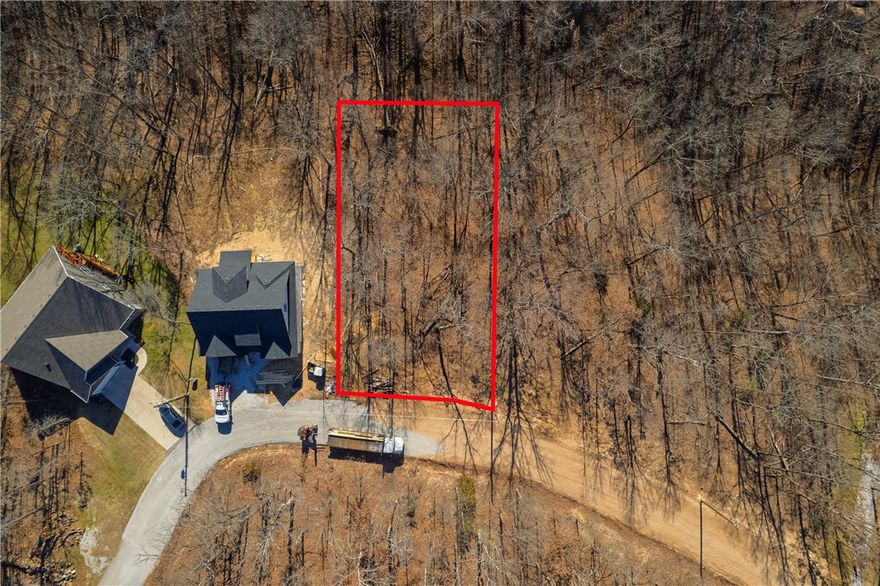 Build your future home on this 0.28-acre vacant lot located in the Sussex Subdivision of Bella Vista. Situated on Bexhill Circle, this property offers a quiet, established setting surrounded by natural beauty. Enjoy access to all the amenities Bella Vista is known for, including golf courses, scenic lakes, parks, and recreation centers. The lot is also conveniently located near the epic Bella Vista mountain biking trails, making it ideal for outdoor enthusiasts. Walking and biking paths are nearby for everyday enjoyment. Shopping, dining, medical facilities, and Bentonville are just a short drive away.