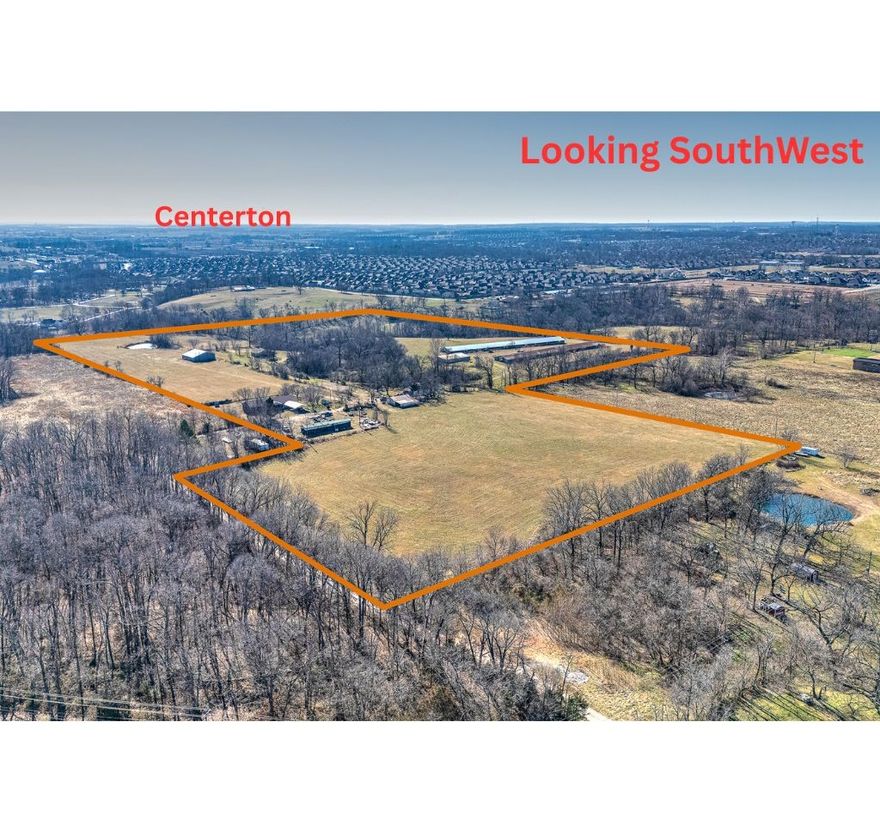 Many opportunities for development potential or keep intact as a secluded estate. Property has 3 ponds. Fenced and crossed fenced, 2 wells and city water at property. Gently rolling landscape provides beautiful building sites with views of surrounding terrain. Centerton plans an 80’ wide road on West side to connect Hwy 72 and Town Vu Rd. Currently zoned A1. It has 2 homes and 1 mobile, but value is in land. Homes are being sold as is.