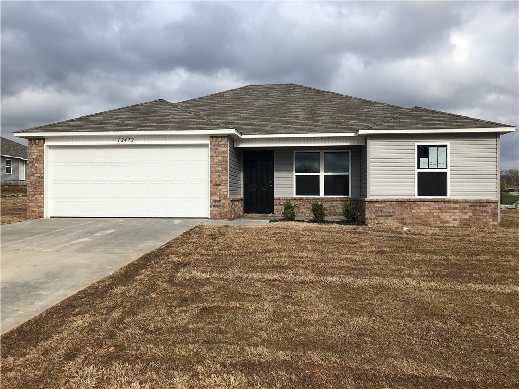 Amazing new 3bd 2ba home. This open concept split floor plan is on a corner lot in a nice and quiet community located just minutes away from down town Rogers, Beaver Lake and I-49. Your family will love the open living room and kitchen, flush mounted bar top, and spacious yard. Get up to $3,500 in closing cost paid w/ preferred lender. 10 year home warranty. Contract in April and receive half off upgrades such as gutters, blinds, Appliances and garage door openers up to $5000. $0 Down Rd Eligible