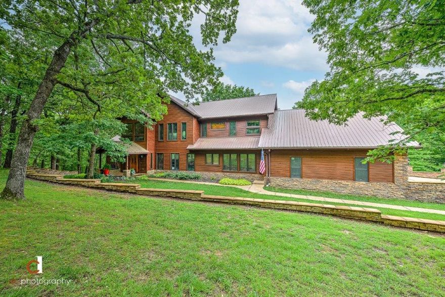 THE ULTIMATE ESCAPE AWAITS YOU IN THIS FABULOUS 5.42 ACRE PROPERTY W/ NEWLY REMODELED 4,255 SQ FT ESTATE!!  Surrounded by nature w/ spectacular views from every room, the main level hosts a gorgeous 2 story living room w/ floor to ceiling fireplace flanked by view capturing windows, an open formal dining room, a brand new kitchen w/ all new soft close cabinets, stainless appliances including a 5 burner gas cooktop, double ovens, ice machine plus enjoy an “award winning” pantry like no other!!  A second living room, large guest suite w/ full bath huge walk-in tiled shower w/ wheelchair access, a 2nd guest suite/office w/ half bath and a large laundry room complete the main floor.  The second floor features a beautiful private master suite w/ en suite bath and amazing walk-in closet w/ second laundry room, a second living w/ vaulted beamed ceilings & amazing views, bonus room & a library w/ built-ins.  Fabulous back deck runs the length of the house, heated & cooled storage under house, storage shed w/ electricity!