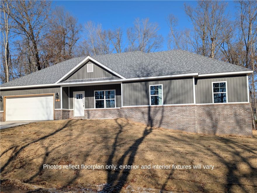 This stunning residence combines contemporary board and batten design with a classic brick skirt, offering premier curb appeal near Highlands Golf Course and the shores of Loch Lomond. The interior features an efficient 3-bedroom, 2-bath layout finished with durable tile flooring and premium quartz countertops in both the kitchen and bathrooms.
Equipped for modern living, the home includes all new appliances, custom blinds, and a programmable thermostat. A cozy fireplace serves as the heart of the living space, while the exterior is rounded out with gutters and low-maintenance siding. This move-in-ready gem perfectly blends high-end finishes with an unbeatable Bella Vista location.
