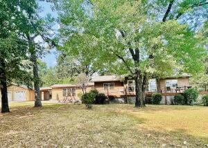 Private home with 11 gorgeous acres with a large shop! This home has three bedrooms, 2 baths, and a great office/bonus space. The living area has tons of room and the kitchen features gorgeous 2 inch granite countertops. You will fall in love with the huge pond and acreage that is perfect for goats and horses. The massive shop is perfect for vehicles, boats, or any of yours favorite hobbies. This exterior has great curb appeal and the roof, siding, and doors were all replaced in 2018!