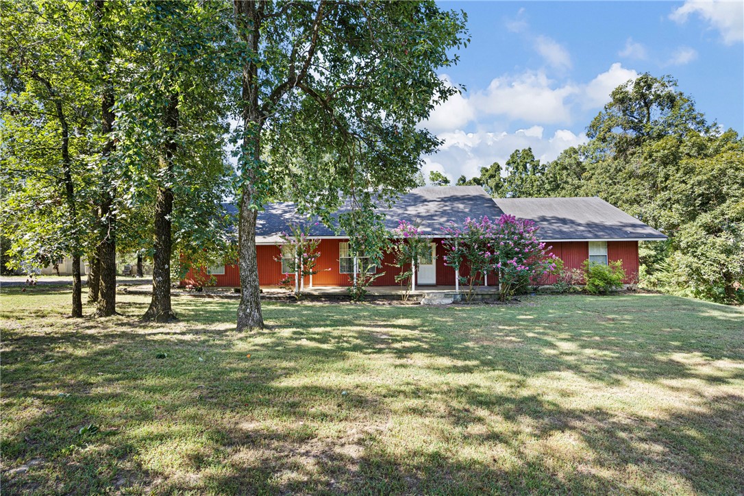 Nestled just minutes from town, this spacious family home offers the perfect blend of country charm and convenient living. With plenty of room to run, play, and grow, the property is ideal for creating unforgettable memories. Enjoy peaceful surroundings, fresh air, and open space—without sacrificing access to schools, shopping, and amenities. Whether it's backyard games or quiet evenings on the porch, this home has it all!