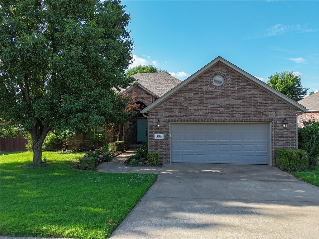 Welcome Home! This stunning 4-bedroom, 2-bathroom, 2,631 sq ft brick home is nestled in a highly desirable subdivision with a community pool. Perfect for both entertaining and everyday living, it features a functional layout, formal dining room, vaulted ceilings, and quality finishes throughout. Built in 2003 and fully renovated, this move-in ready home boasts brand new flooring, fresh paint, new windows, and stylish upgrades. You'll love the extensive crown molding, granite countertops, ample cabinetry, and a charming two-sided fireplace. The spacious primary suite includes two walk-in closets and a large bath with a separate tub and shower. Located minutes from the University of Arkansas, shopping, dining, and scenic trails—this home offers the perfect blend of comfort, style, and convenience.