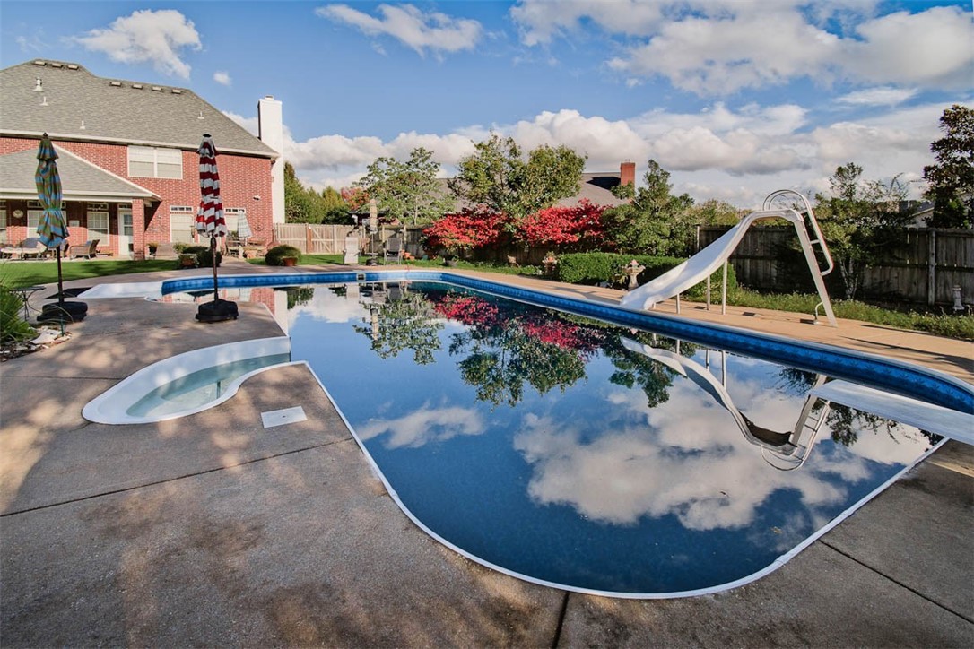 Prime Location! This home offers the best of both worlds - easy access to major city amenities like the AMP & the Promenade with your own private sanctuary on a beautifully landscaped, nearly 1/2 acre corner lot. The centerpiece of this oasis is the heated salt water pool perfect for relaxation and outdoor entertainment! Get creative with the custom built āman cave/she shedā currently used as an exercise room. Zoned irrigation systems in the front and backyards. Open kitchen and living room has spectacular natural lighting with an office, dining room, and half bath on the first floor. 2nd floor has a spa like owners suite with large bedroom, en-suite bathroom and closet. 3 additional bedrooms, full bath, and spacious laundry room are all located upstairs. New hardwood floors, HVAC and water heater 2 years old, utility sinks in the laundry room and garage, new pool filtration system and pool liner is 1 year old. Side load garage has ample parking. Subdivision has great access to the Razorback Greenway.