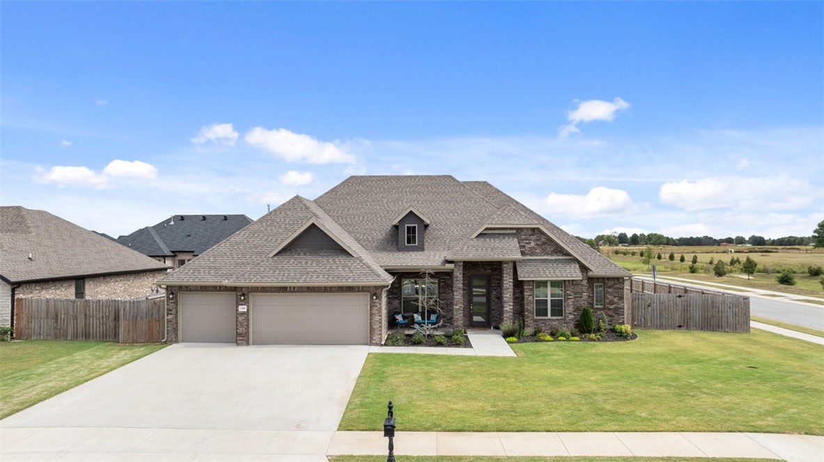 Compared to it's competition in Tontitown, this corner lot home offers an "after market" custom island with double sinks, pop up power center, with storage cabinets and drawers and corner seating breakfast bar. Additional custom cabinets built in the living room as an accent wall and plenty of space to showcase your design style. The engineered hardwood floors are beautiful and the dedicated office provides an extra room for flex space. Enjoy the storage and possibility of the highly desired 3rd car garage space!