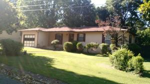 Clean 2 (could be 3) bedroom home on a large level corner lot just outside the city limits; privacy fenced backyard; deck; huge master bedroom; concrete parking; this one was built by a contractor as a personal home