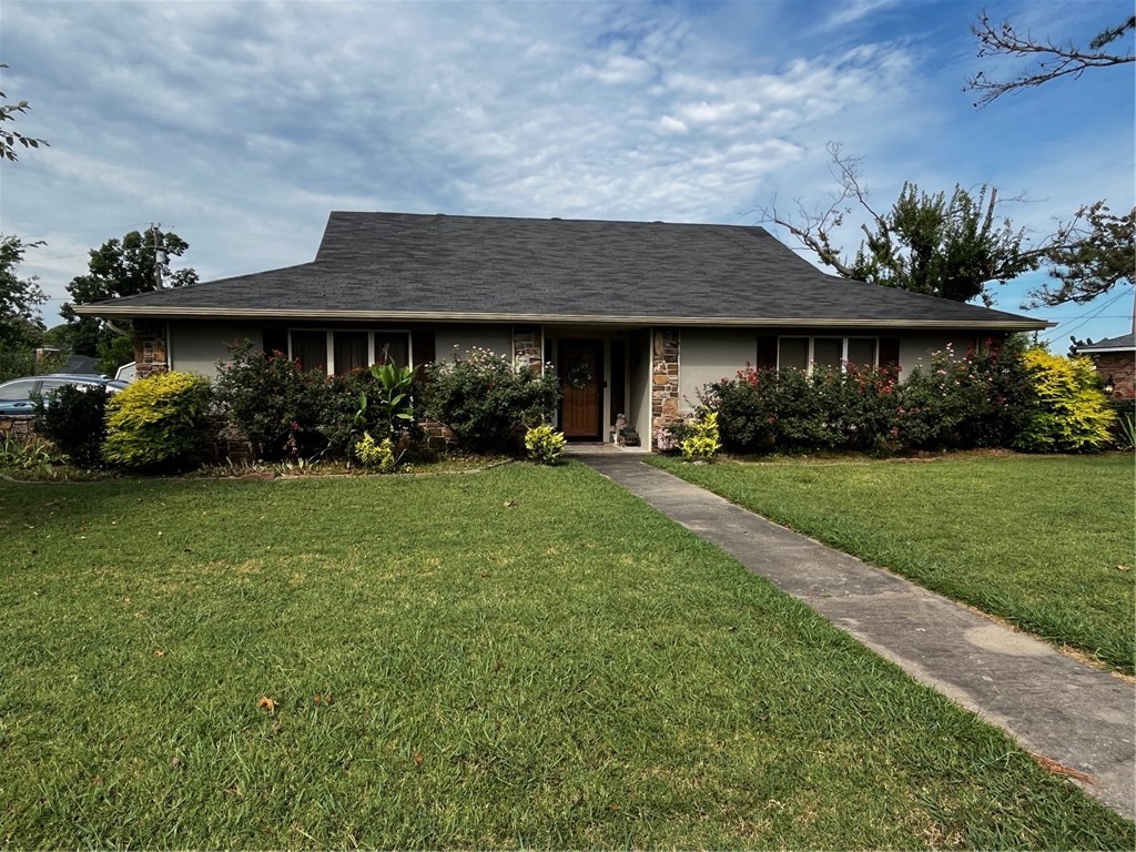 Wonderful home on oversized lot in an established neighborhood. 2 sunrooms, one is private off of the primary bedroom. Large living room with rock fireplace. 3 bedrooms PLUS 4th flex room. Granite counters, vaulted LR ceiling, two storage sheds, walk in closets throughout.