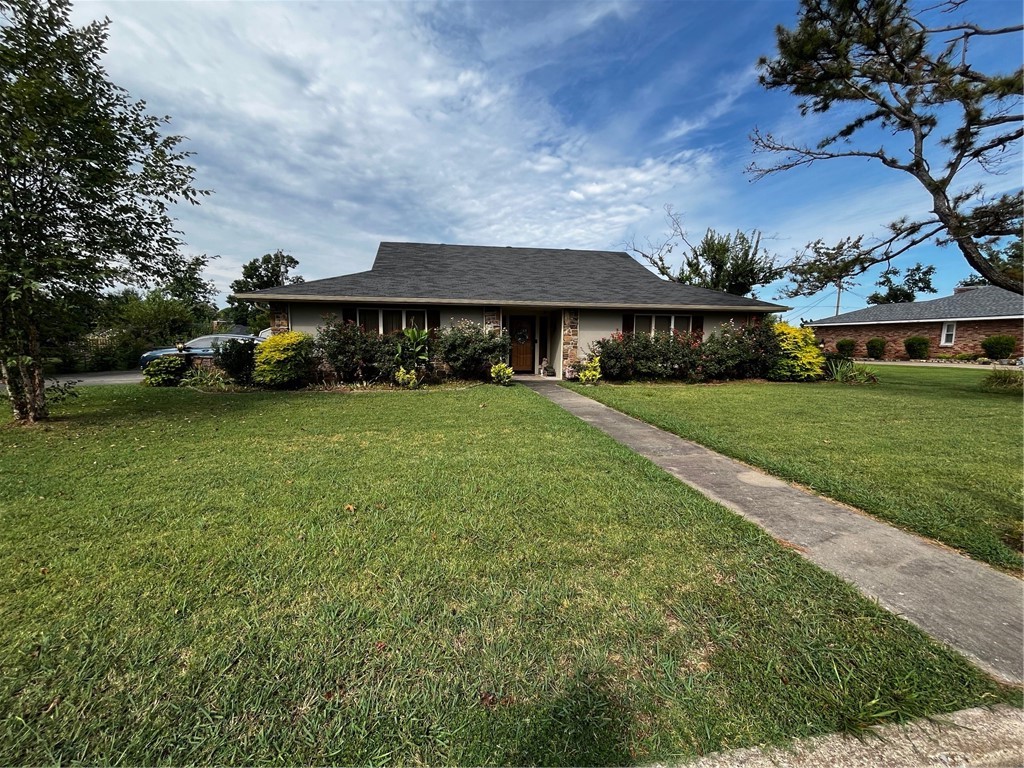 Wonderful home on oversized lot in an established neighborhood. 2 sunrooms, one is private off of the primary bedroom. Large living room with rock fireplace. 3 bedrooms PLUS 4th flex room. Granite counters, vaulted LR ceiling, two storage sheds, walk in closets throughout.