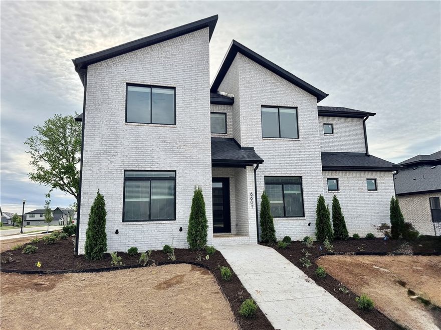 New construction modern home with gorgeous exterior in sought after community of Aurora. Enjoy the stunning two story living room with soaring ceilings, tiled linear fireplace, crown molding, engineered wood flooring & light streaming through ample amount of windows. Kitchen features large custom painted island, quartz countertops, pot filler, stainless steel appliances, gas cooktop, custom cabinets, double ovens, walk in pantry & storage! Home features a secondary bedroom & study on the main level. Private primary bedroom with custom beams, painted accent wall and luxurious ensuite bathroom. Primary bath with double sinks, walk-in tile shower and stand alone soaking tub. Upstairs features three large bedrooms, 5th bedroom would be a perfect bonus room. Huge covered patio overlooking the large corner lot! Aurora residents have access to TONS of community amenities. Adult pool, family pool, bike repair station, dog park, elevate fitness course, sports court, open air clubhouse & playground! Internet included in POA!