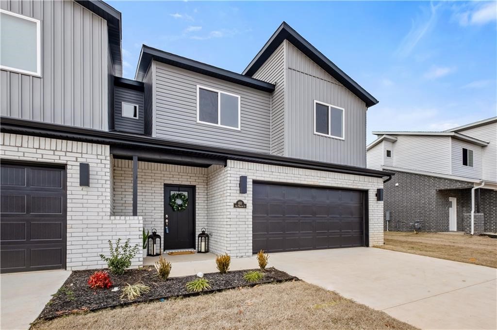 Welcome to Brixley at Sun Meadows Phase 2, Centerton's premier upscale townhome enclave! These newly enhanced townhomes feature vented gas stoves, large, expansive windows, fully fenced yards, and more. These modern residences redefine luxury with spacious layouts and cutting-edge designs. Located just blocks from Bentonville West High School, sports facilities, and shopping, these twin homes offer convenience and sophistication. Each townhome has three bedrooms, two and a half baths, a 2-car garage, and 1601 square feet of living space. Tall, vaulted ceilings, neutral color palettes, and designer lighting enhance the contemporary aesthetic. Thoughtful craftsmanship and a prime location create a refined living experience. Additional features include blinds and gutters, making these homes move-in ready. Multiple units available. Seller offers $2500 seller credit towards closing costs.