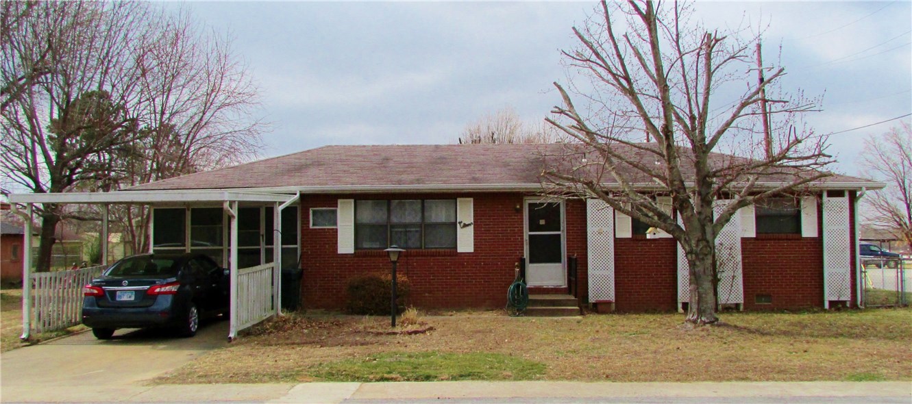 If you are looking for small town living with 3 bedroom, 1 bath, brick home under $80,000.... You Found It! Only 12 minutes West of I49 and close to the local schools, this home also has a 12' x19' sunroom that is not included in the net living area square footage. There is an awesome storm shelter in the back yard. Remember that Prairie Grove qualifies for Rural Development Authority financing with no down payment.