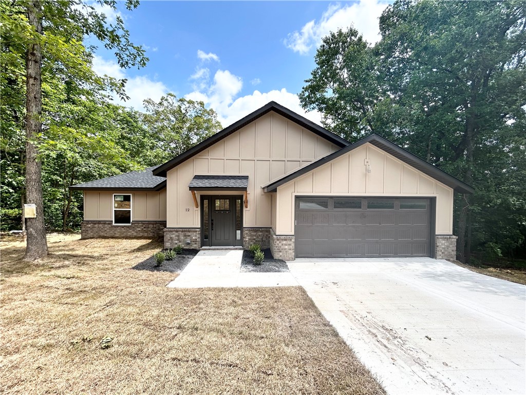 New construction on a beautiful .41 acre wooded lot near Scotsdale Golf Course! Step inside to discover an inviting living room featuring a gas fireplace, cathedral ceilings, and tons of natural light. Seamlessly connected, the open living space flows into a thoughtfully designed kitchen: complete with a generous island, custom cabinets, gas range, and 3cm quartz countertops. The primary bedroom offers a serene retreat, featuring an ensuite with a walk-in tile shower and dual vanity. Outside, a spacious backyard and expansive covered patio await; providing the perfect setting for hosting gatherings with friends and family! Property backs up to POA land. $3,000 IN BUYER CLOSING COSTS PAID FROM BUILDER'S PREFERRED LENDER!