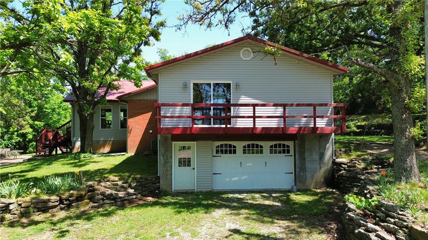 Beautiful park like setting on 2 acres m/l sprinkled with mature trees surrounding a prime multigenerational opportunity just under 5 miles from Huntsville! This expansive home boasts 7 beds/4.5 baths total, 4/4 upstairs, featuring a great layout with elevated front-yard views. 20X30 metal storage building. The real bonus is the versatile lower level with its own private garage access, approx 1462 sq ft great for a dual-living suite, mortgage helper, or income-generating rental. Discover endless possibilities for income and flexible use—come see it today! Great location off of hwy 74 for easy commuting all over NWA!!!
