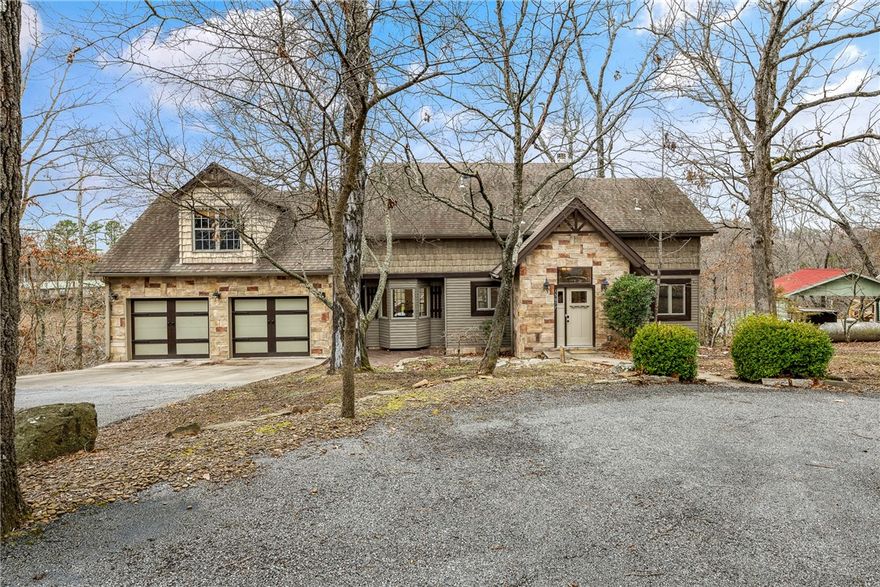 This stunning lakefront property on Beaver Lake offers breathtaking views with direct access to the water and a new private boat dock and walkway. Situated on 1.47 acres, this spacious 2,939-square-foot home is designed for both relaxation and entertainment. With five bedrooms and four bathrooms, the layout provides ample space. Currently operating as a successful Airbnb, the home features three full kitchens, two spacious living rooms, and a game room, making it ideal for hosting guests. A wood-burning fireplace in the main living room adds warmth and charm, creating a cozy retreat during cooler months. Whether enjoying the lake from the comfort of the home or taking advantage of the private dock for boating and fishing, this property offers the perfect balance of comfort and adventure. The combination of scenic surroundings, updated amenities, and income potential makes this a rare opportunity for investors or those seeking a peaceful getaway. Boat dock and Furniture to convey to Buyer at closing.