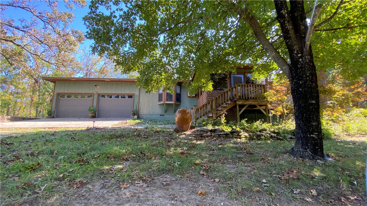 This charming country three-bedroom and two-and-a-half-bath farmhouse with a two-car garage is the perfect opportunity to add your own personal touch! Nestled in a lush, tree-filled countryside and close to the Berryville airport, this special property provides plenty of opportunity to create your own piece of paradise. This property was along the Trail of Tears and has a peaceful serenity to it, that pictures do not do justice. Not only is there a large 40x40 shop building, but also a pole barn, old barn, and outbuilding, along with an adorable small old home, and RV parking with hookups and lush land featuring beautiful maple trees. Don't miss your chance to make this home your own and be part of something truly special. Bring your vision and make it your own! The big shop building is being rented out at $800 per month for additional income, with the option to keep it rented long-term if desired.