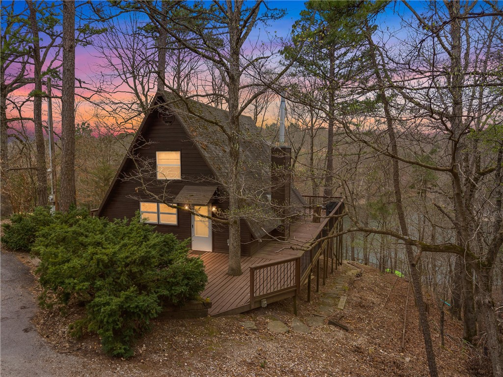 Charming lakefront property on the stunning Beaver Lake, tucked away in a peaceful, quiet area. If you’re seeking tranquility and relaxation in a natural setting, this is the perfect spot. This home boasts 250 feet of shoreline, stunning lakefront views, and a short 75-foot walk to the water, where you can enjoy a cleared “beach” area perfect for swimming, fishing, or anchoring your boat. The home was remodeled about 8 years ago, with updates including a new blacktop driveway and Pex plumbing installed 3 years ago. And a new mini-split system and a septic pump-out were done in 2024. It was successfully run as an Airbnb/VRBO for 2.5 years and consistently stayed booked! VRBO Link here: https://www.vrbo.com/1963606 for access to reviews. Additionally, this property is available fully furnished. Schedule your showing today!