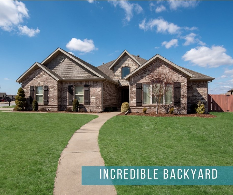 Beautiful home tucked into great Rogers location! Attention to detail throughout this home is unbelievable. Living room boasts grand, stone fireplace and opens up to kitchen and dining room through matching brick archways. Beautiful wood cabinets and granite countertops enhance the openness of the kitchen's space. Extra long drawers under the gas stove solve storage solutions. Make memories around the table in the bright, open dining room that sits between living room and kitchen. Large master bedroom rests under recessed ceiling finished in trim, giving the room depth. Complete with double vanity sink, walk-in shower and jetted tub, master bathroom feels spa-like. Relax or entertain in the very large, private backyard under the covered patio. Minutes away from Village on the Creeks, I-49 access, Pinnacle Hills Promenade, Highrise, Rogers Aquatic Center!