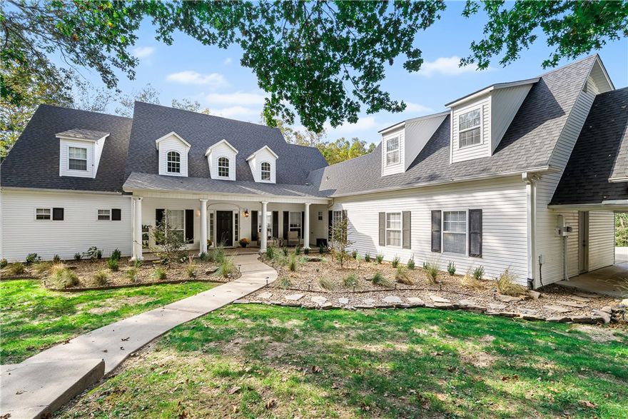 This well-maintained 4BR, 3.5BA custom home offers privacy in a convenient location on 3.7 acres. Recent updates include fresh paint, new carpet, deck replacements, updated lighting & fans, landscaping, three Trane HVAC systems (2024), an 80-gallon water heater (2025), and a new septic system (2025). This home features generous living spaces and is perfect for hosting events or comfortable everyday living. The bedrooms & closets are roomy and provide plenty of storage throughout. Downstairs, there's a stylish den connected to a craft room equipped w/sink, which could even be converted into a darkroom for photography enthusiasts. Upstairs, you'll find a secluded area ideal for a media room, as well as an additional bonus room situated above the detached garage. With 4751 SF, the home features a spacious living room with a two-story ceiling and large windows, a generous eat-in kitchen with ample cabinet space, formal dining, and a classic front porch. Enjoy woodland views from the back deck. Schedule a viewing today.