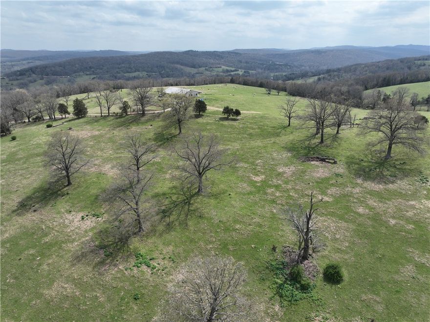 45± acres of prime pasture land just 7 miles south of Huntsville, Arkansas, offering the perfect blend of productivity, beauty, and location. This fully fenced property is ready for livestock and features a pond for water along with utilities already on site, making it an ideal setup for a future homesite or working farm. Take in the panoramic views from multiple building sites, with rolling terrain that captures the natural beauty of the Ozarks. Located near the clear waters of War Eagle Creek, you’ll enjoy easy access to fishing, kayaking, and outdoor recreation. Whether you’re looking for land for sale in Huntsville AR, a cattle-ready pasture, or a peaceful place to build your dream home, this property checks all the boxes. Convenient to town yet private enough to enjoy country living, this is a rare opportunity in Madison County.